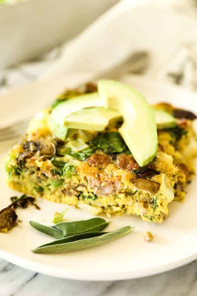 Keto breakfast casserole vertical image piece of casserole on plate