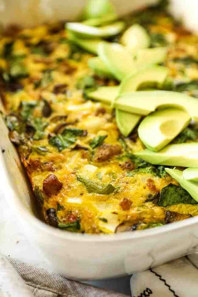 Keto breakfast casserole vertical image casserole in dish close up at an angle