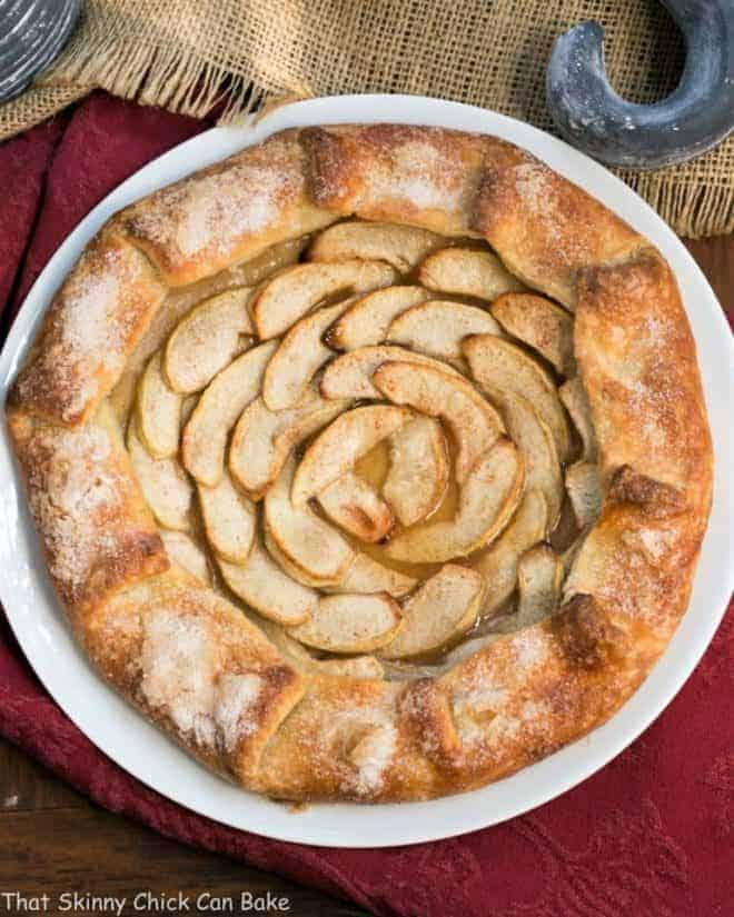 Maple Glazed Apple Galette - A lovely, rustic autumnal dessert Maple Glazed Apple Galette on a white ceramic serving plate