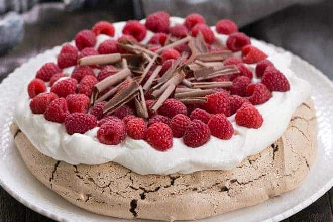 Chocolate Raspberry Pavlova - A sublime dessert with a chocolate meringue topped with berries and cream