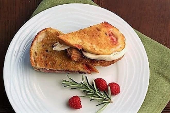 Mozzarella Grilled Cheese with Raspberries and Brown Sugar viewed from above on a white plate