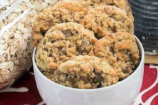 Chewy Oatmeal Toffee Cookies in a white bowl featured image