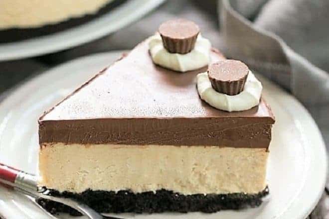 A slice of Chocolate Peanut Butter Pie on a white dessert plate with a red handled fork