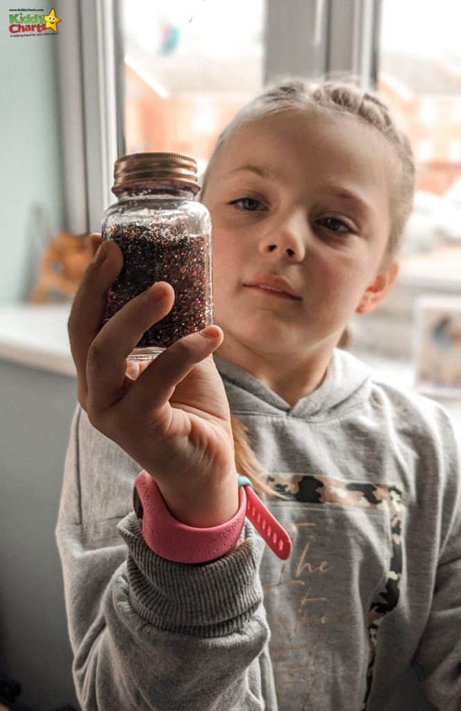Young girl holding a jar #31DaysOfLearning