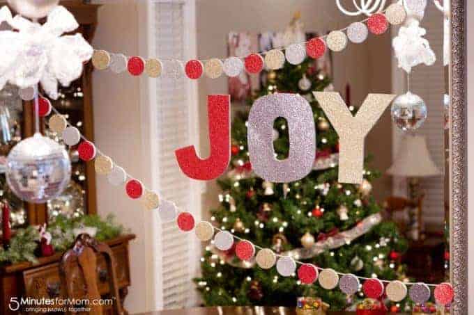 circle garland and joy cut out hanging in dining room