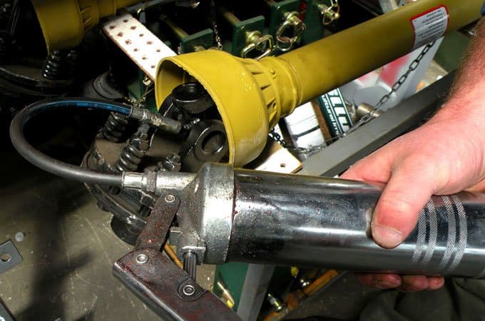 Regularly use a grease gun on the PTO shaft for reducing friction (wear).