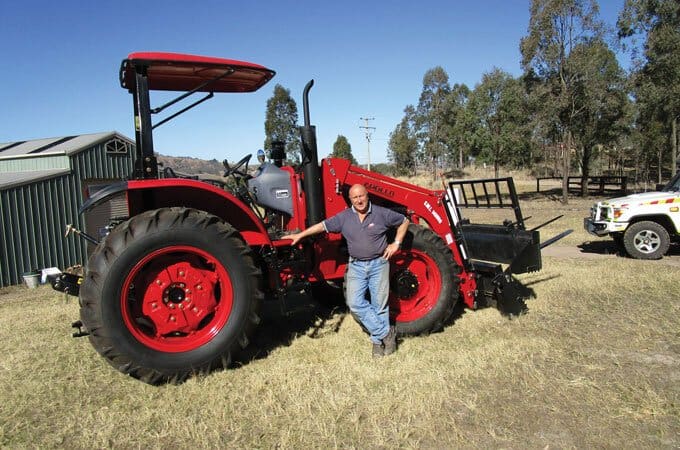 APOLLO 954 95hp tractor, fitted with bale forks.