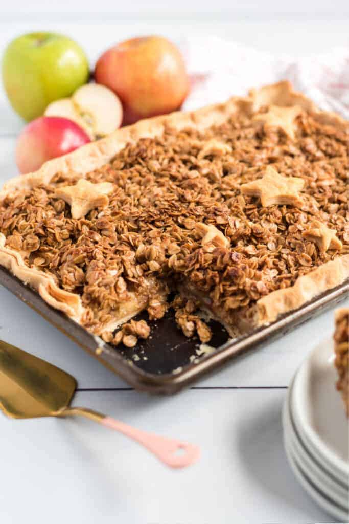 apple slab pie with star crusts and apples on table