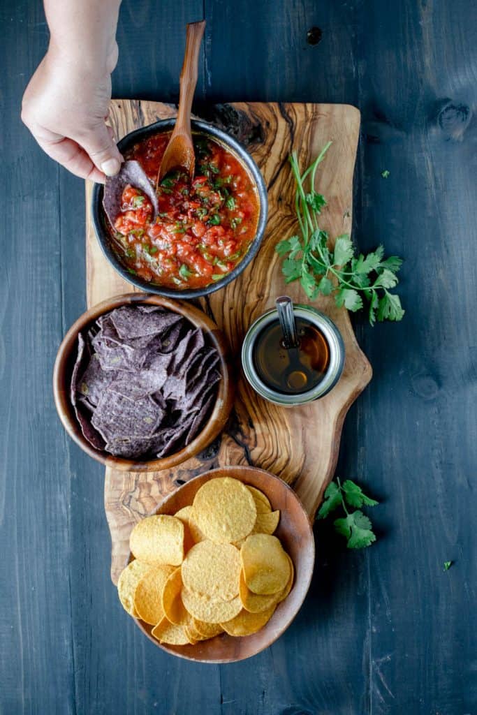 Tomato salsa, corn chips and oil
