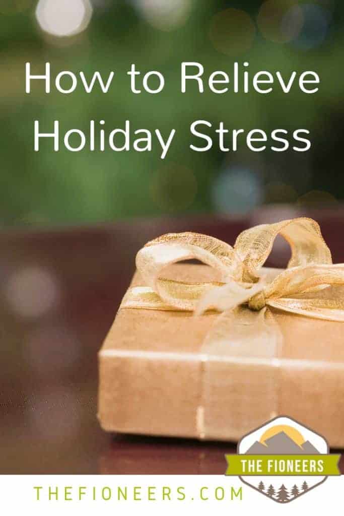Close up of a gift wrapped in gold paper with gold ribbon and text "How to relieve holiday stress"