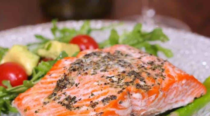 Roasted Salmon on bed of Asparagus on glass plate