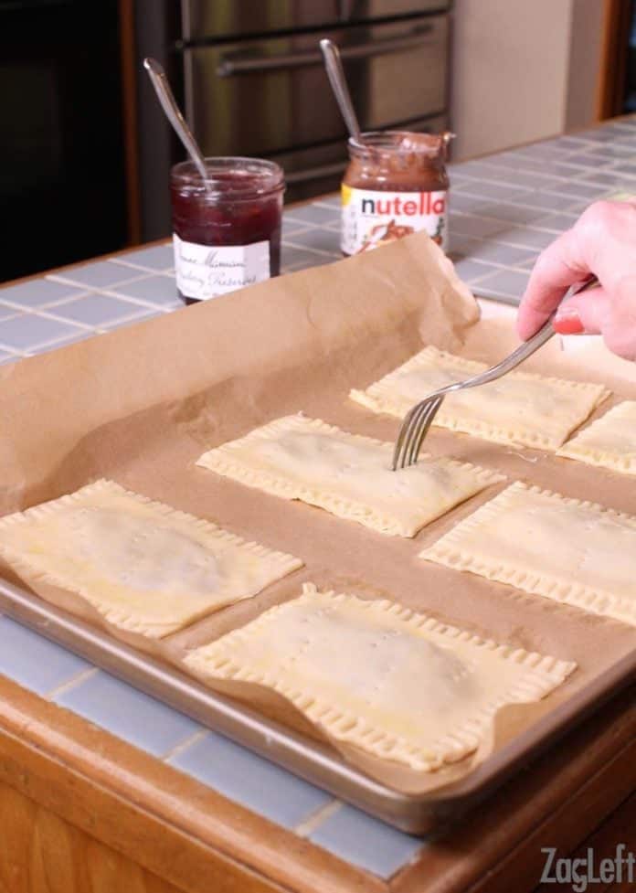 Poking the tops of the toaster pastries with a fork before baking