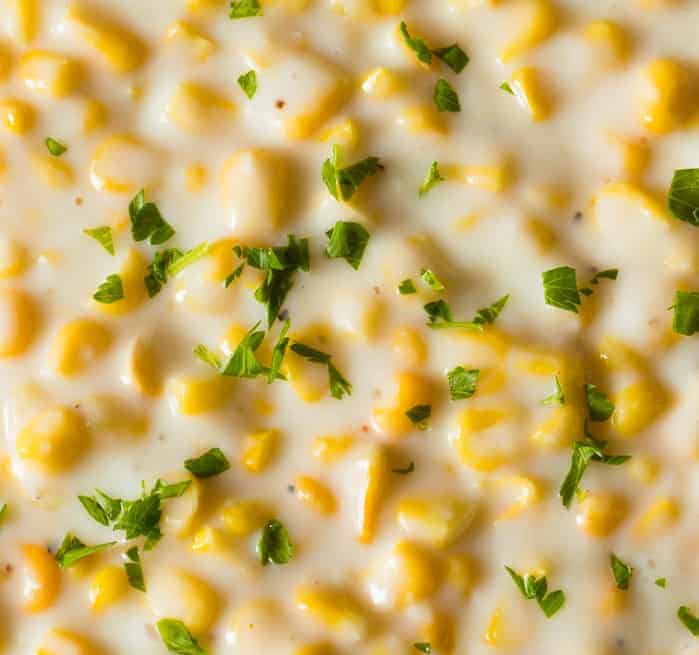 2 Creamed Corn Recipes (with & without cream) A closeup shot of creamed corn