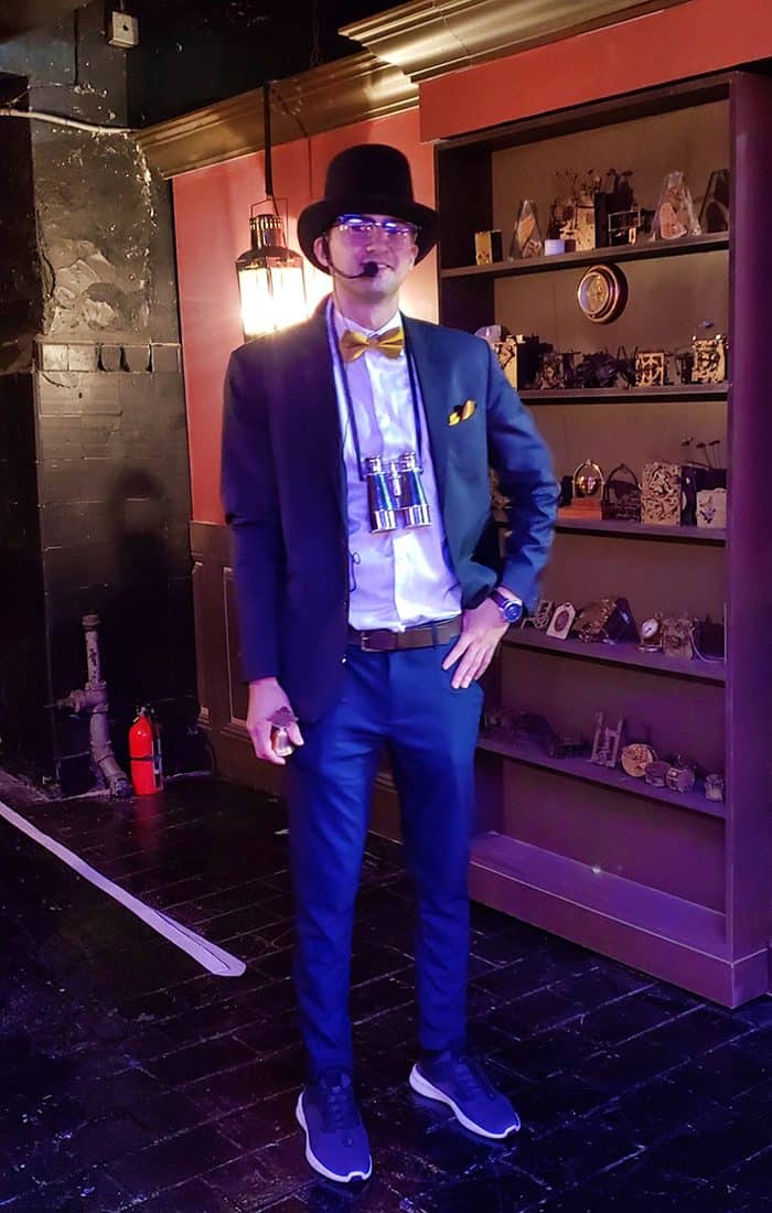 Candytopia greeter Man dressed in a suit and t-shirt with a headset microphone