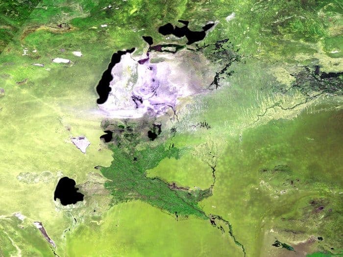 Acquired on May 13, 2014, the 300 m-resolution Proba-V image depicts the white salt terrain left behind by the southern Aral Sea receding, now called the Aral Karakum Desert. The greenery to the south is cultivated land irrigated by the Amu Darya river.
