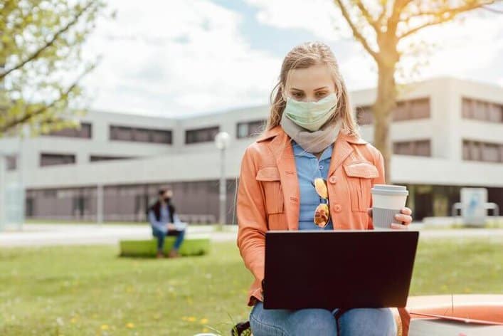 VA FAQ veteran education benefits: Student studying on college campus during covid-19