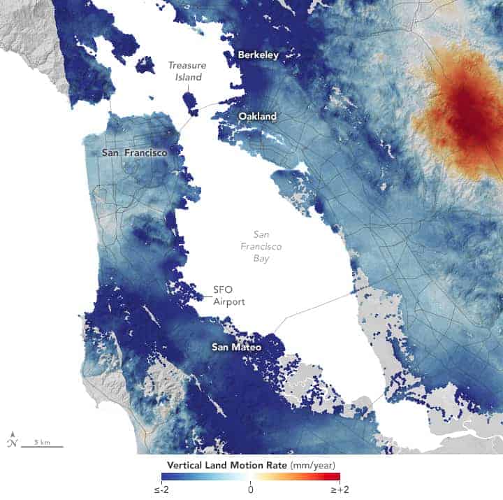 Areas shown in blue on this map are subsiding, with darker blue areas sinking faster than lighter blue ones. The areas shown in dark red are rising the fastest. The map was created by comparing thousands of scenes of synthetic aperture radar (SAR) data collected between 2007 and 2011 and 2014 and 2018.
