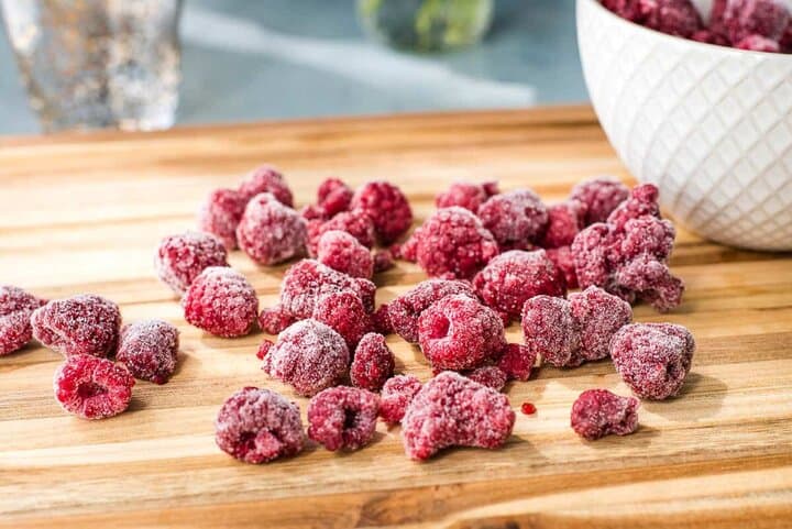 Frozen Oregon raspberries on a cutting board.