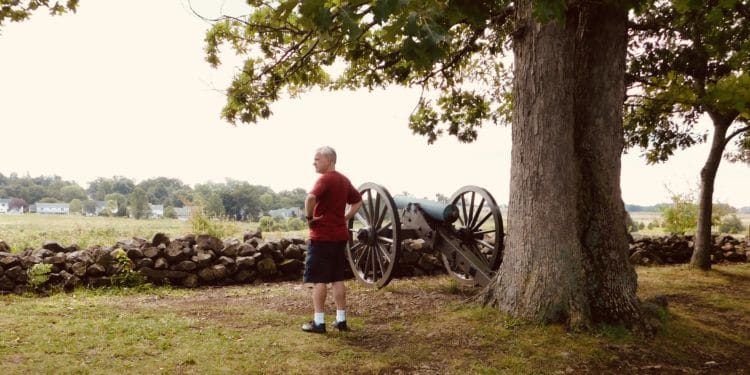 A man takes in the Gettysburg battlefield from Seminary Ridge.