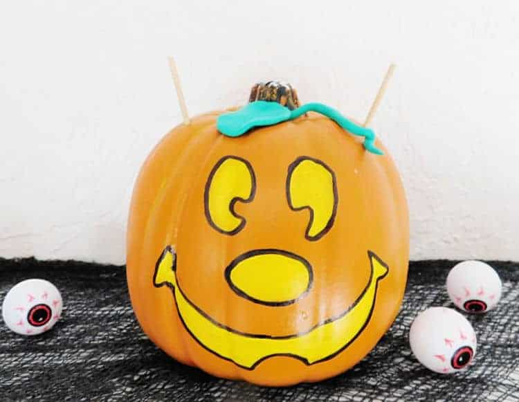mickey pumpkin with bamboo skewers coming out of each side