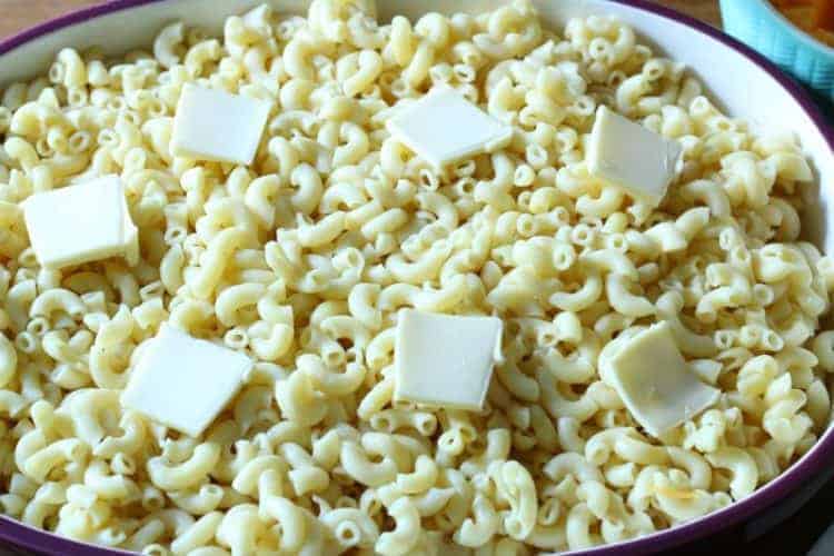 Homemade oven-baked macaroni and cheese - second layer of butter