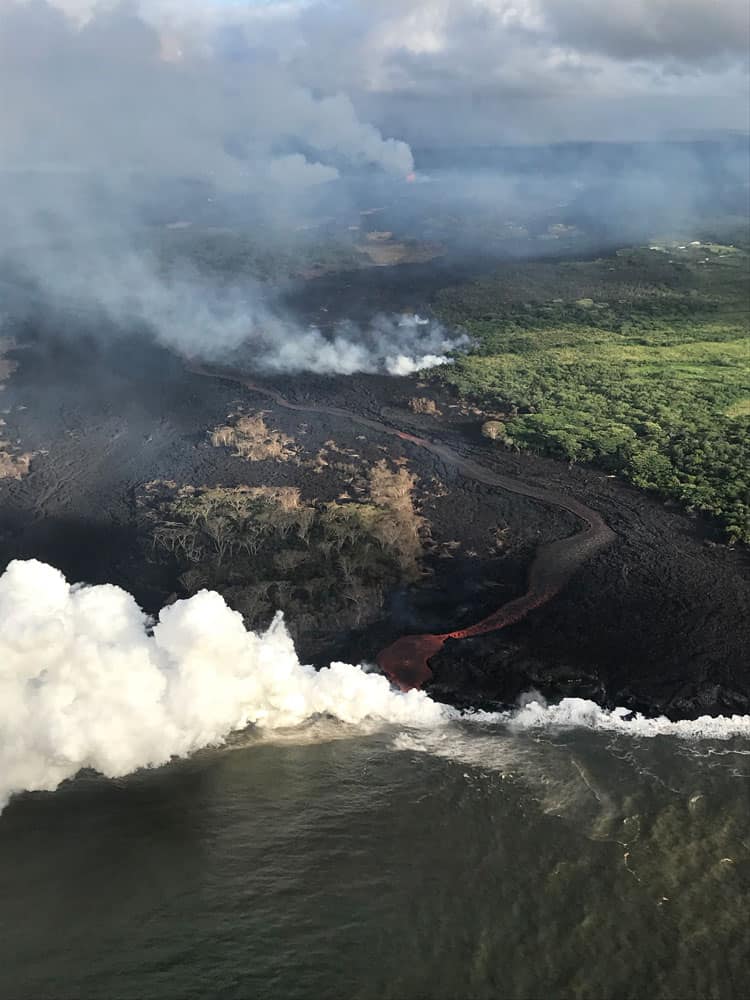 Aerial view of a channelized lava flow and active ocean entry. Image: USGS-HVO, May 22, 2018.