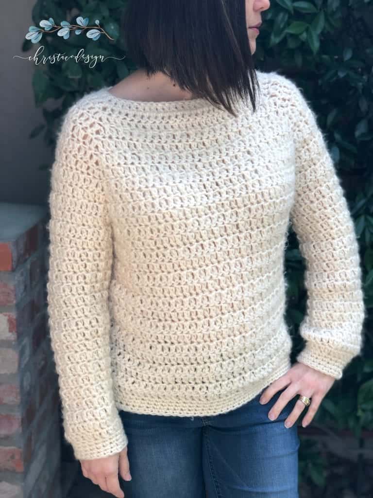 picture of woman in ivory chunky crochet sweater