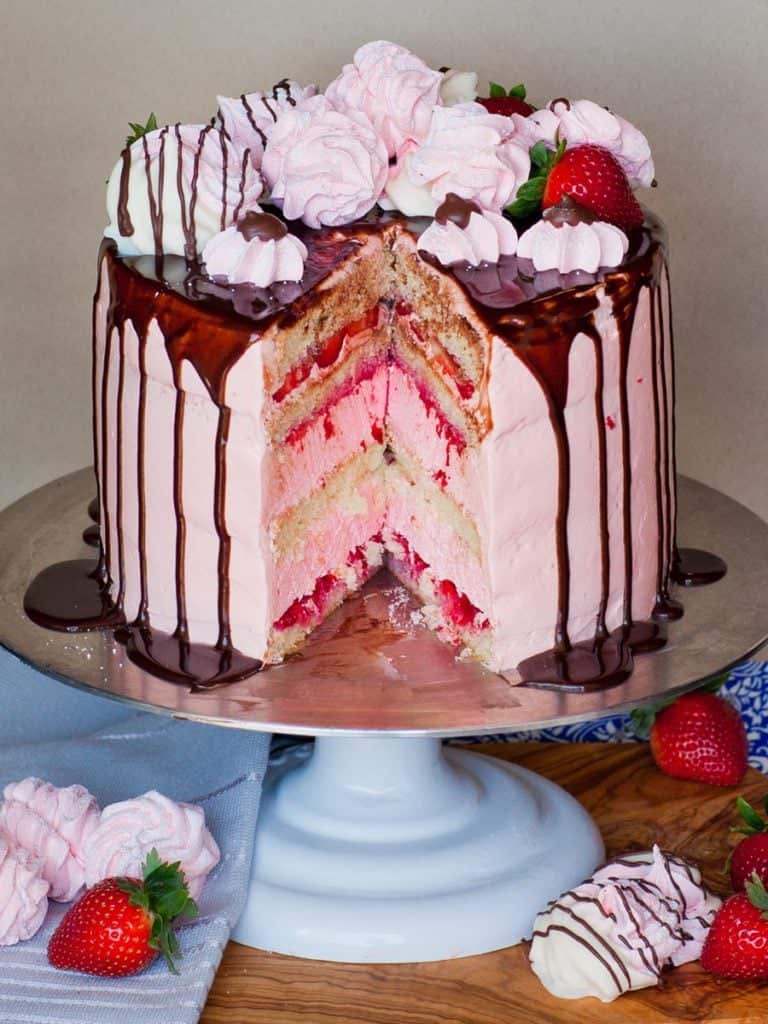 sliced strawberry marshmallow cake with chocolate ganache