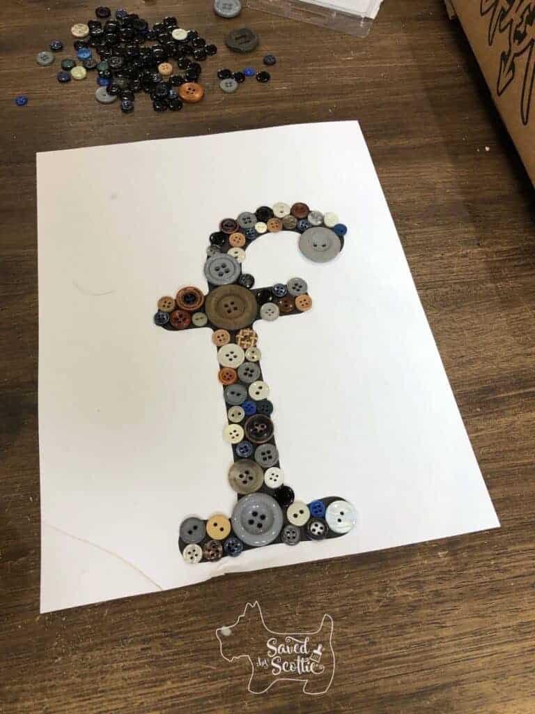 printed lowercase letter f with buttons spread out across it.