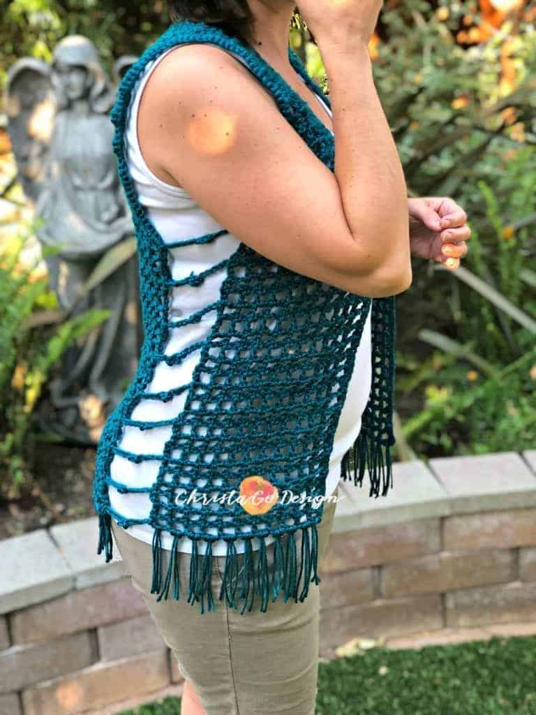 picture of woman wearing crochet mesh vest teal