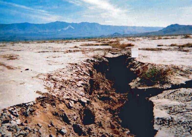 Land subsidence in California, due to groundwater withdrawal. Fissures near Lucerne Lake (dry) in San Bernardino County, Mojave Desert, California. View to the southwest, with 5-gallon bucket for scale.