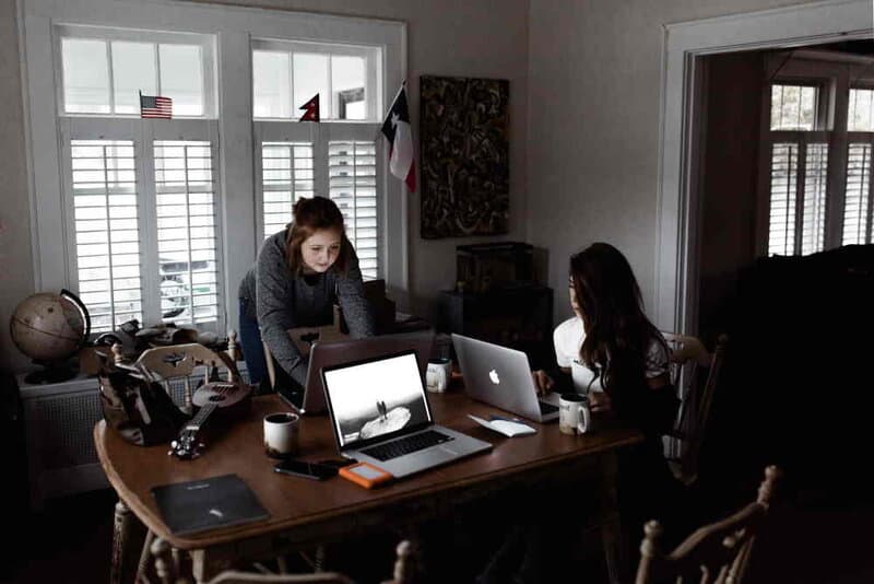Two women working in an office. Photo by Andrew Neel