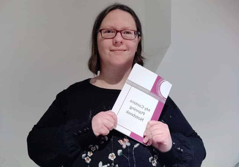 Rachel Extance holding My Content Planning Notebook