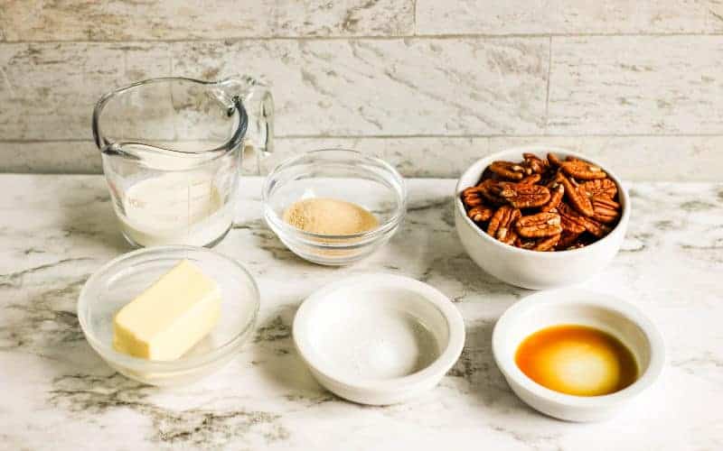 all the ingredients for pecan praline on a table waiting to cook