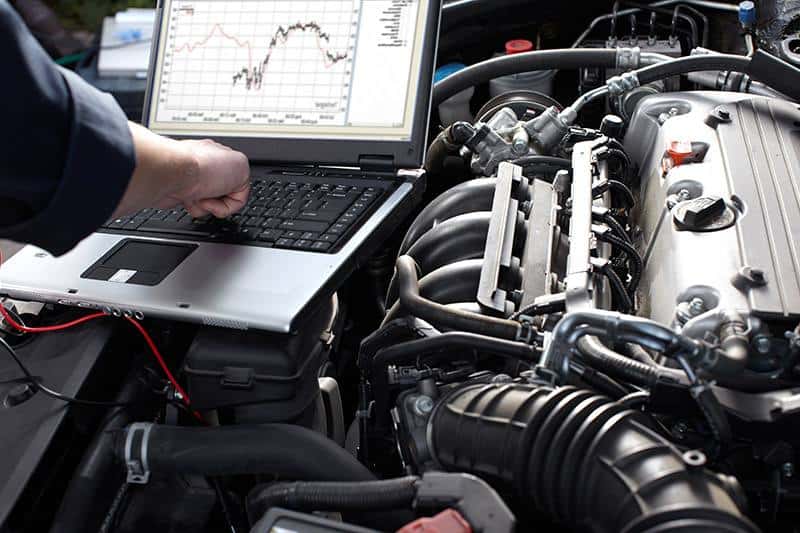 professional car mechanic working in auto repair service