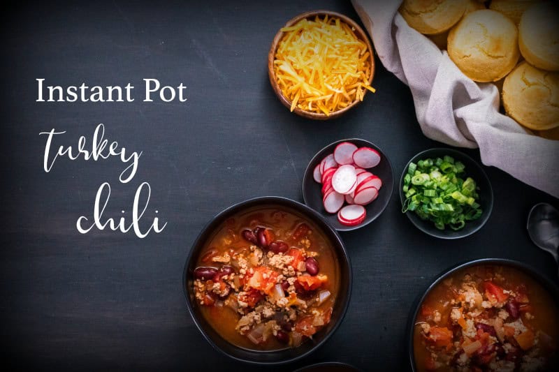 Instant Pot Turkey Chipotle Chili Instant Pot turkey chili garnished with fresh radishes, green onions and cheddar cheese.
