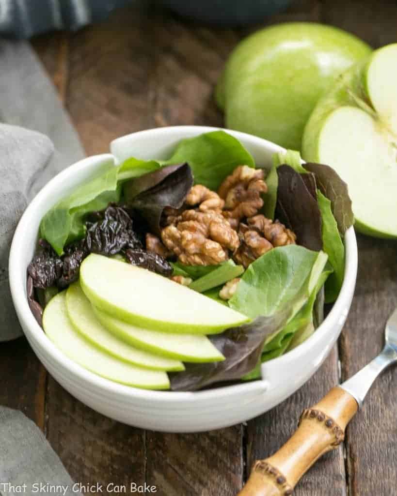 Apple, Cherry, Walnut Salad with Maple Dressing - A fabulous fall/winter salad that always gets rave reviews! Apple, Cherry, Walnut Salad with Maple Dressing in a white salad bowl