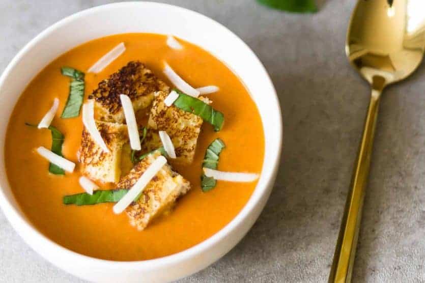 This creamy tomato soup recipe with grilled cheese croutons is so easy and amazing! It's better anything you'll order at a restaurant, and the whole family will love it.