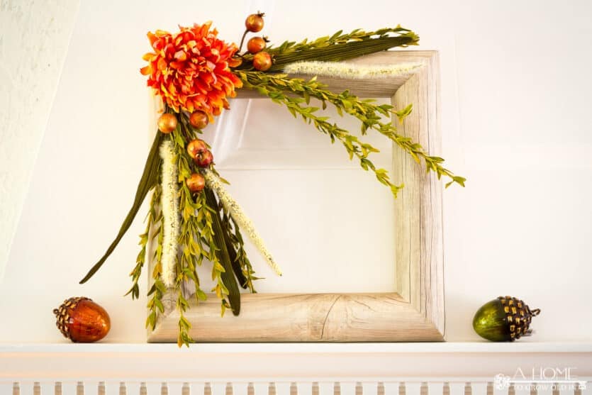 square fall pool noodle wreath on a fireplace mantel
