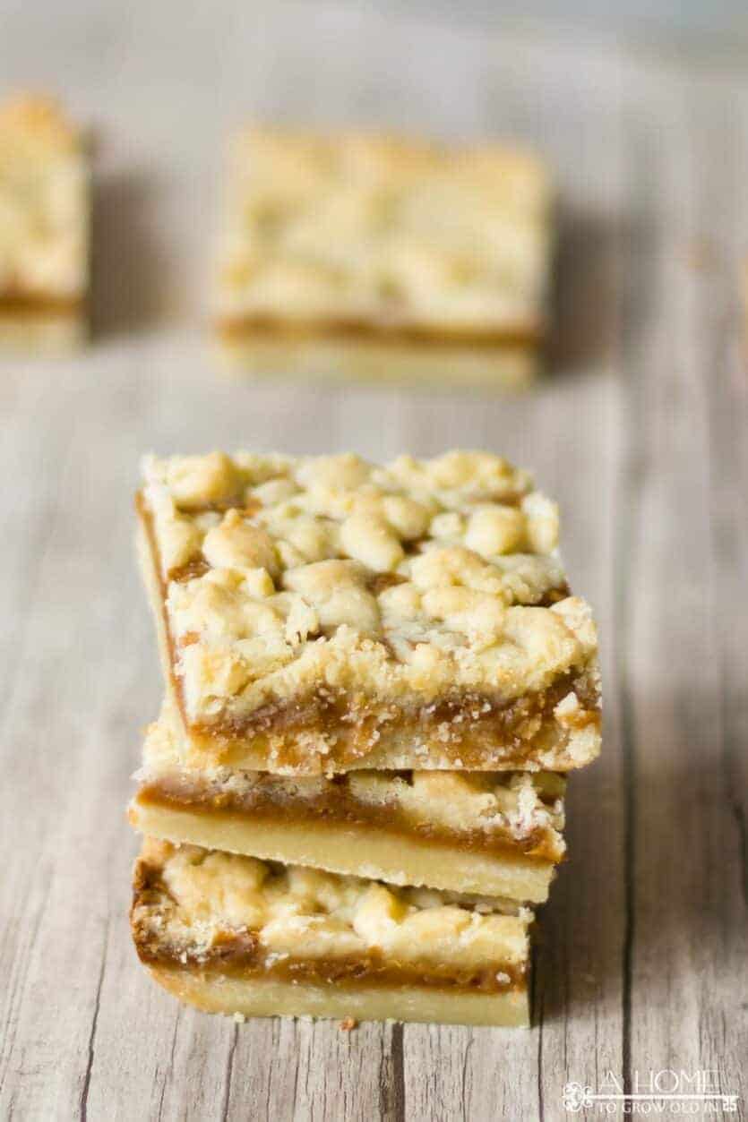 three salted caramel butter bars with a couple out of focus ones in the background
