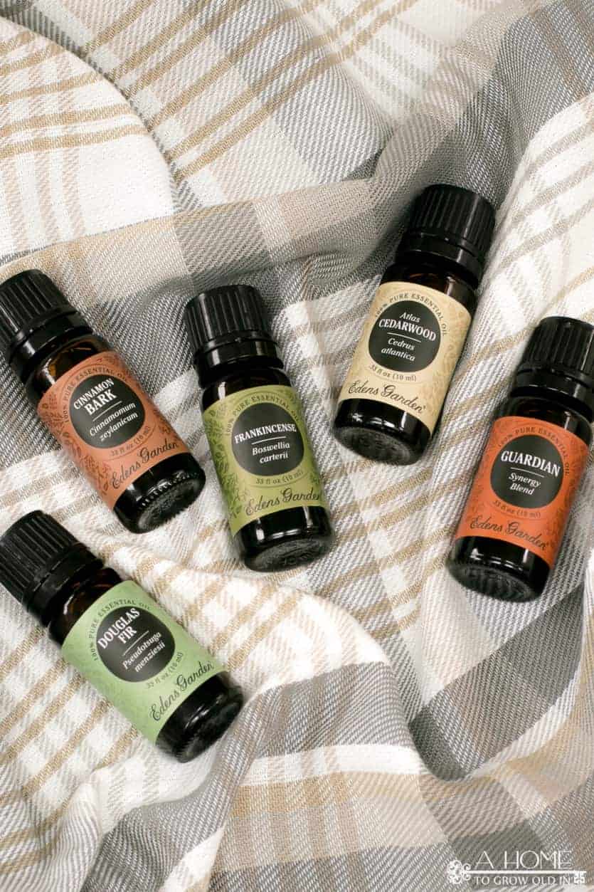 essential oils on a plaid blanket
