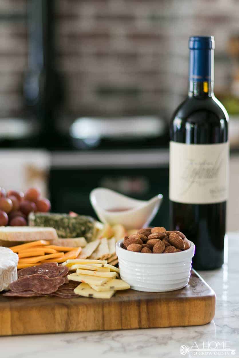 cheeseboard with wine in the background