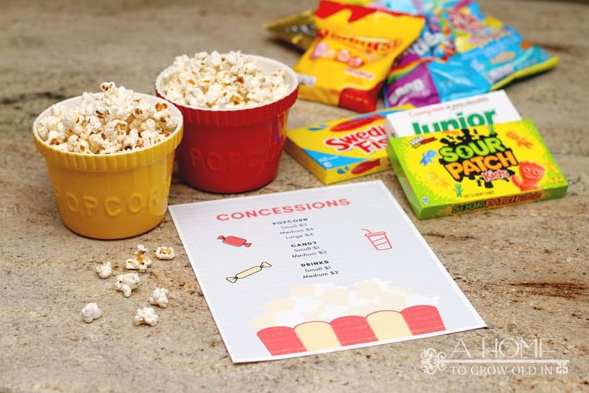 popcorn and candy with a concessions sign