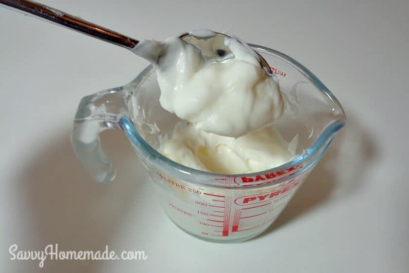 As your mixture starts to thicken add your essential oils, stir well and spoon into a clean jar.
