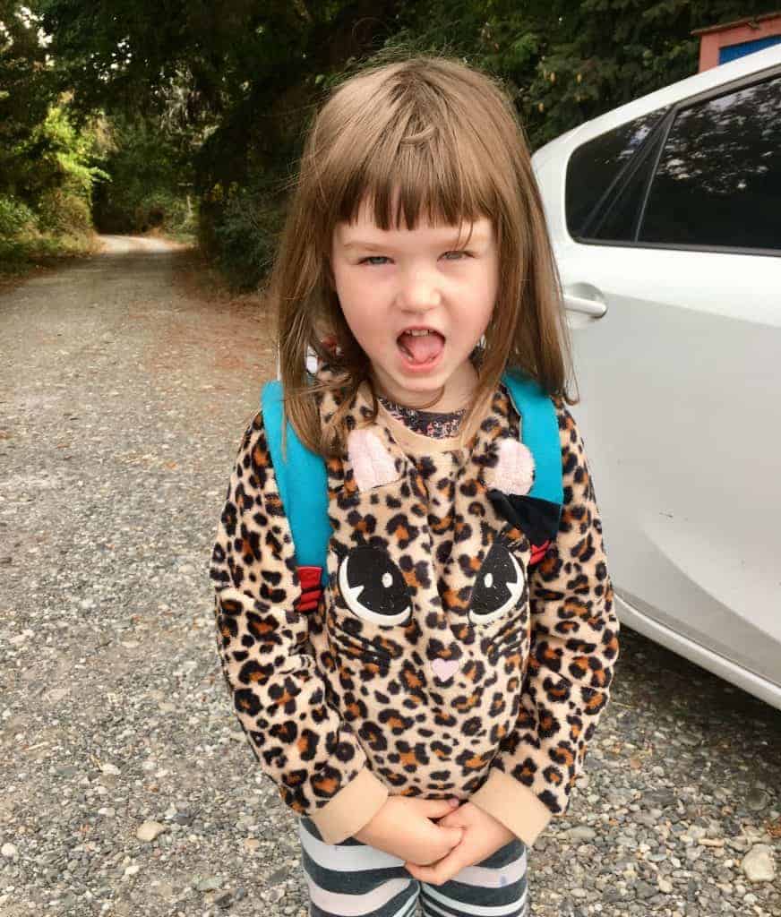 young girl with tongue sticking out