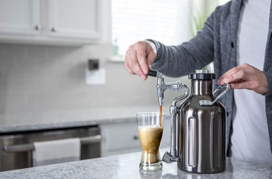 Man pouring coffee from UKeg Nitro Cold Brew