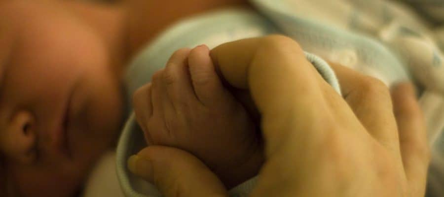 Holding Hands With a Newborn Baby