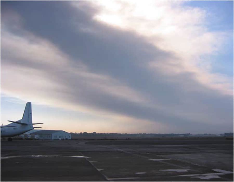 Dark ash from Mt. Etna covering runways at Catania's international airport. Ash fall from Mt. Etna, 30 km from Catania, caused repeated closures at the airport over a 3-month period beginning late October 2002. Photo: Mauro Coltelli . Public domain via USGS.