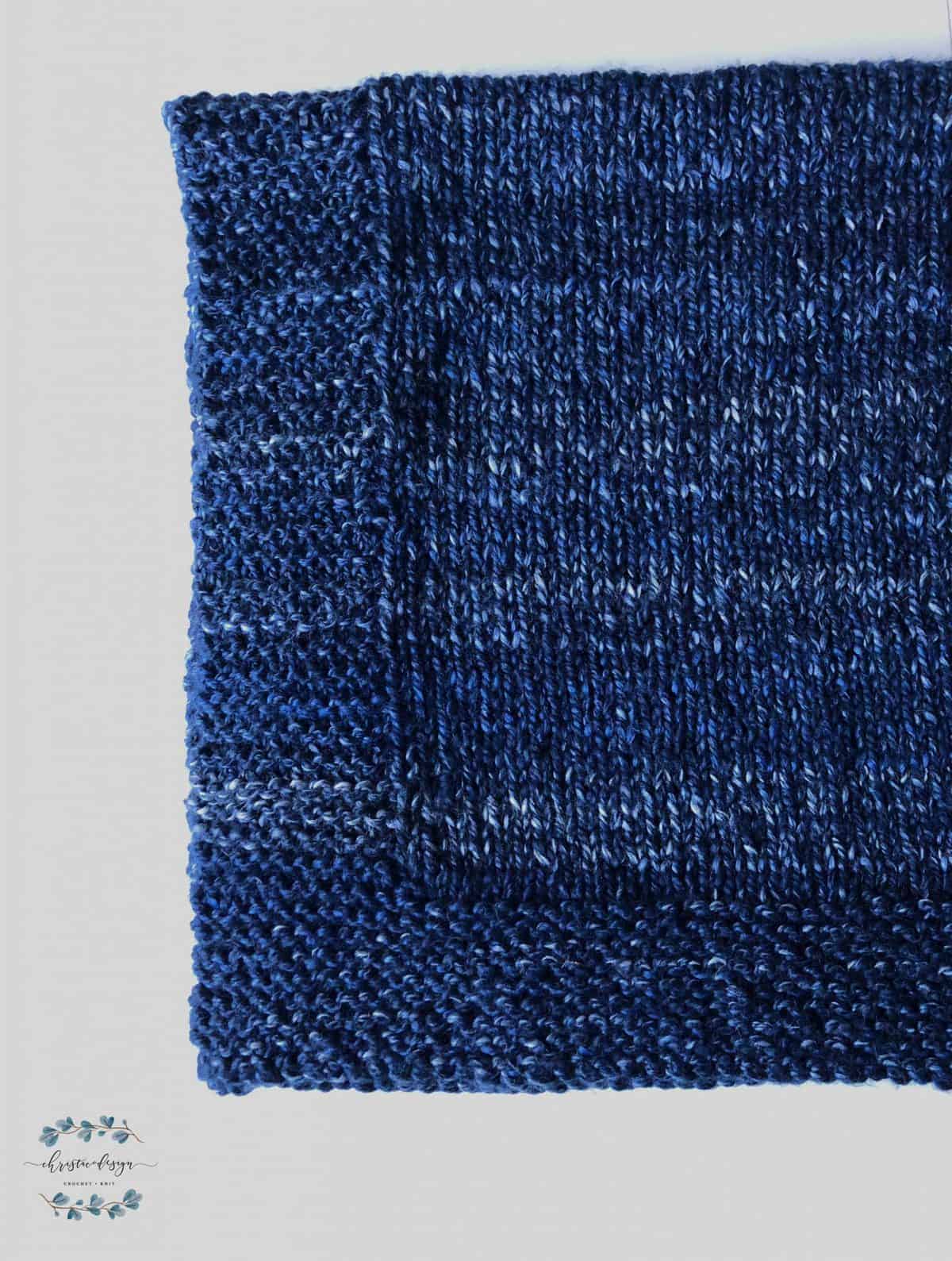 picture of blue knit blanket corner
