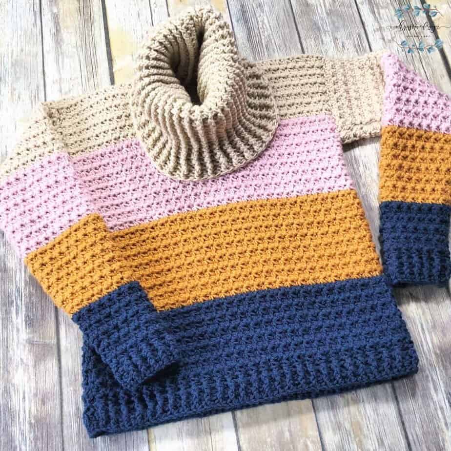 picture of blue, gold, pink and beige crochet sweater in trinity stitch